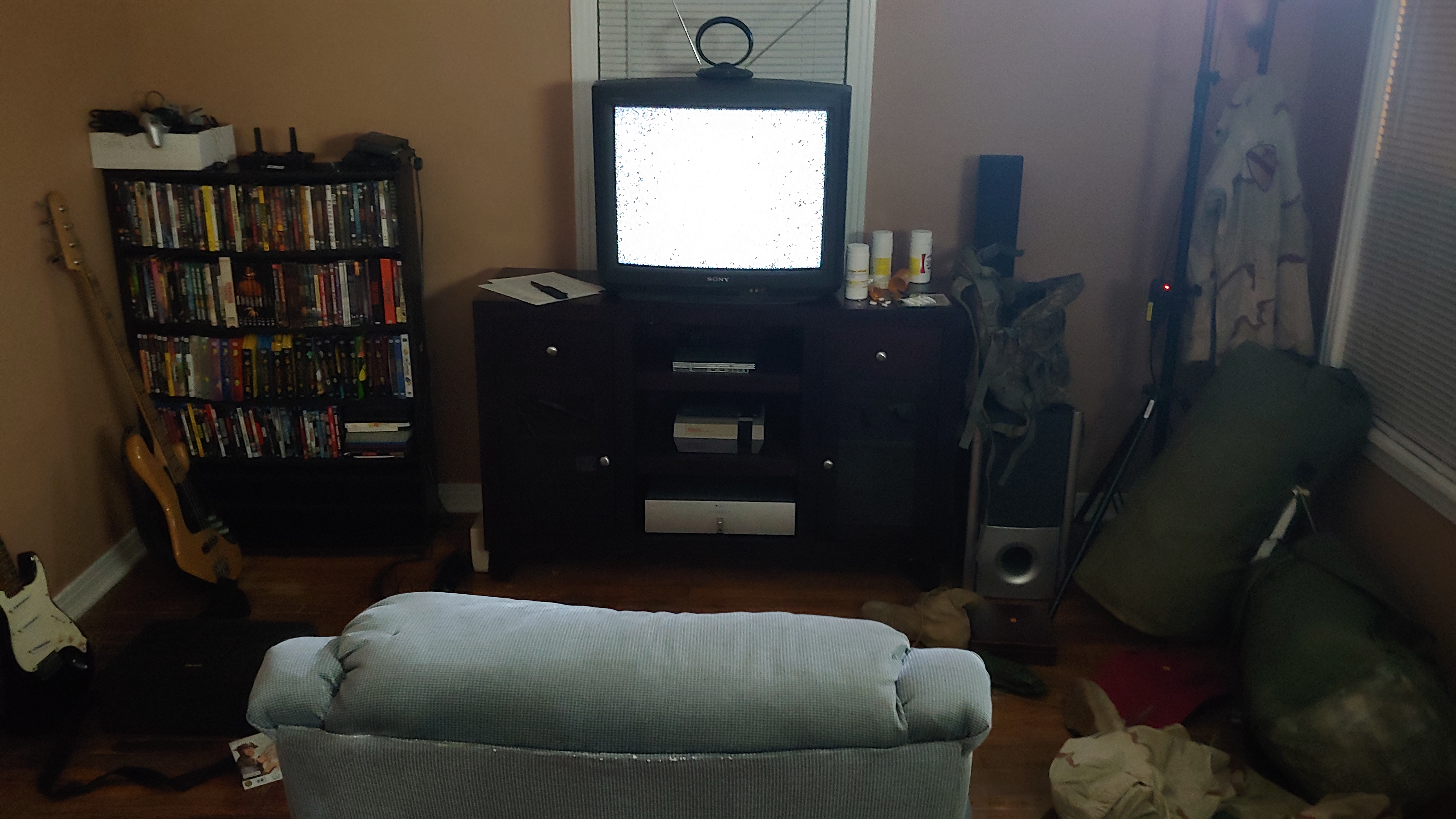 A military veteran's living space with bags packed for deployment